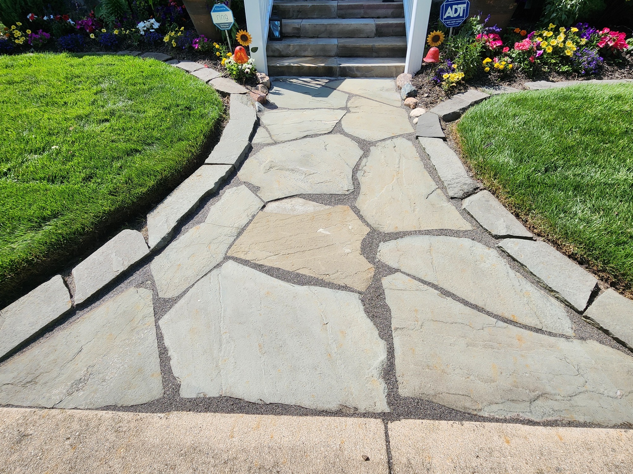 Flagstone walkway with flower beds